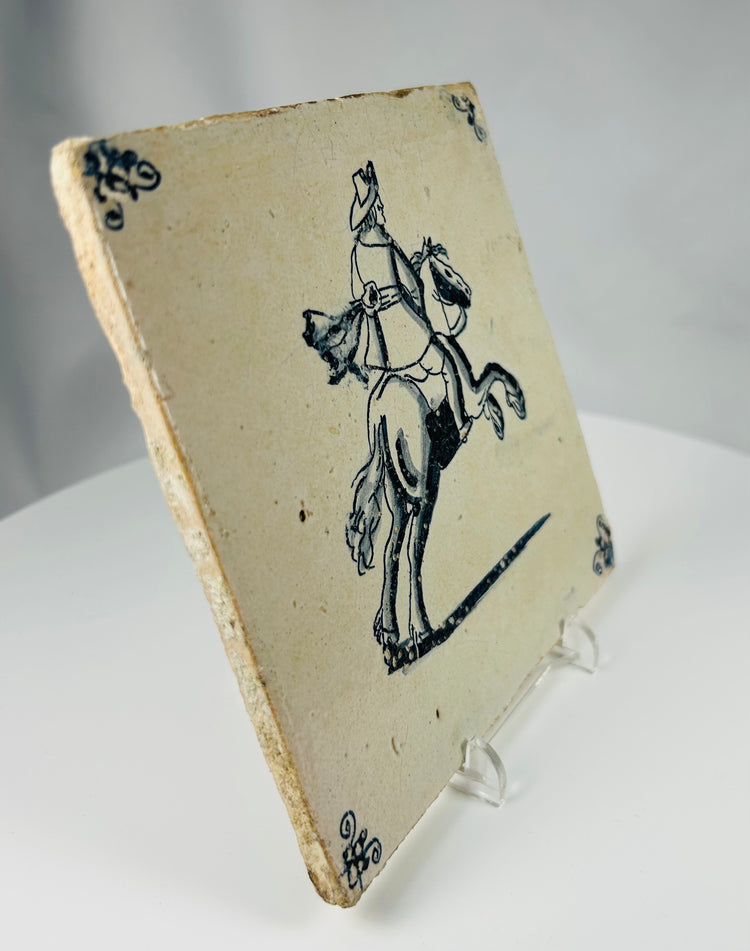 antique Dutch fireplace tile with hand painted rider on horseback