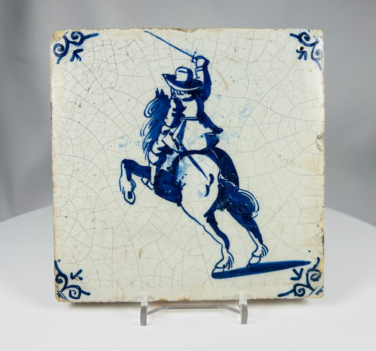 antique Delft blue and white ceramic tile with rider motif