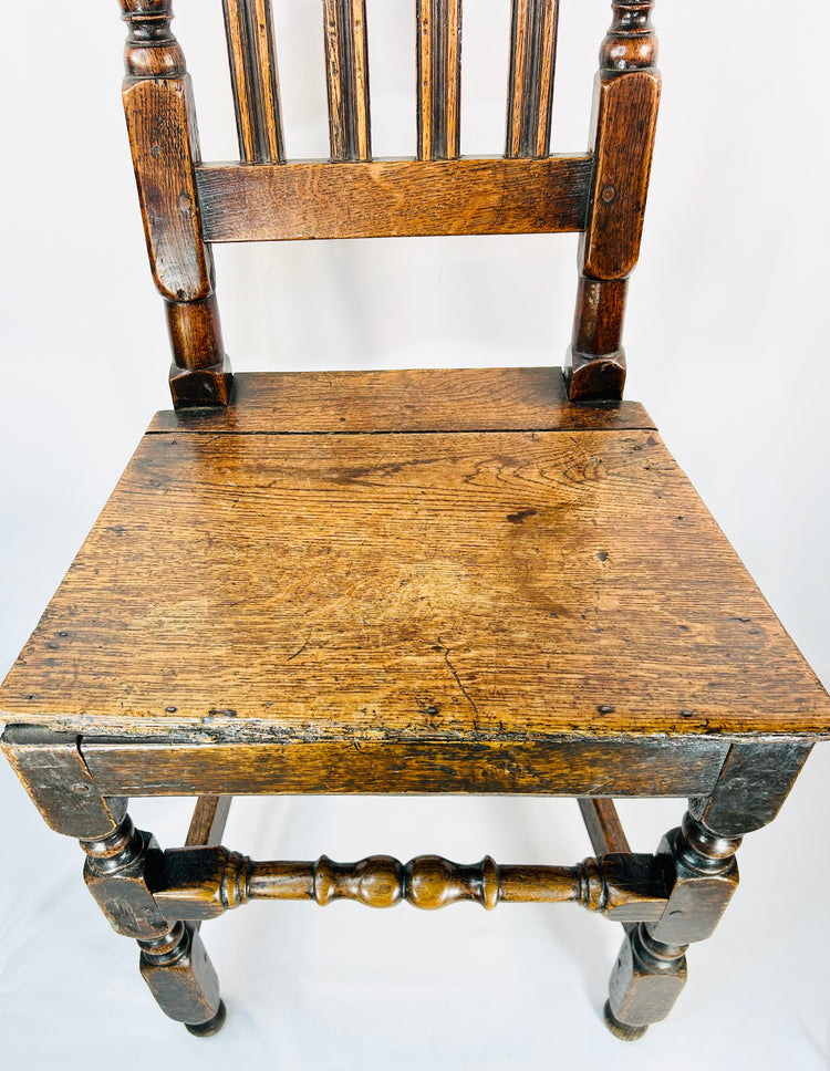 Early English oak high-back chair with block and ball turned front legs and stretcher
