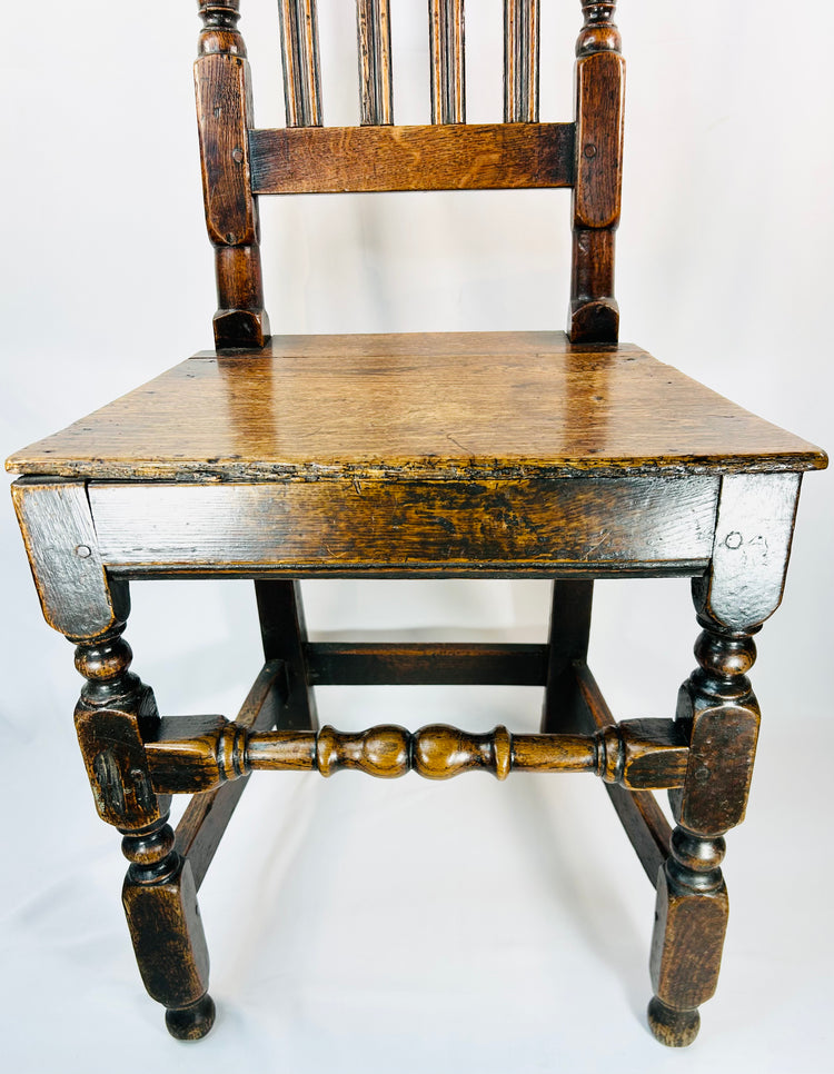 Provincial English oak side chair from the William and Mary period with tall back splats