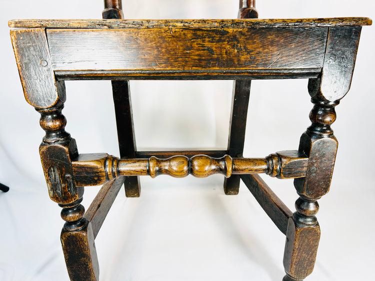 Antique British oak chair with traditional joinery and aged surface patina