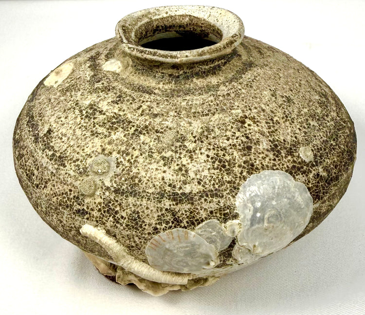 Ancient Chinese Ming Dynasty stoneware jarlet featuring a discoid body, short neck, flared rim, and partially preserved brown glaze dating to the 15th–16th century.