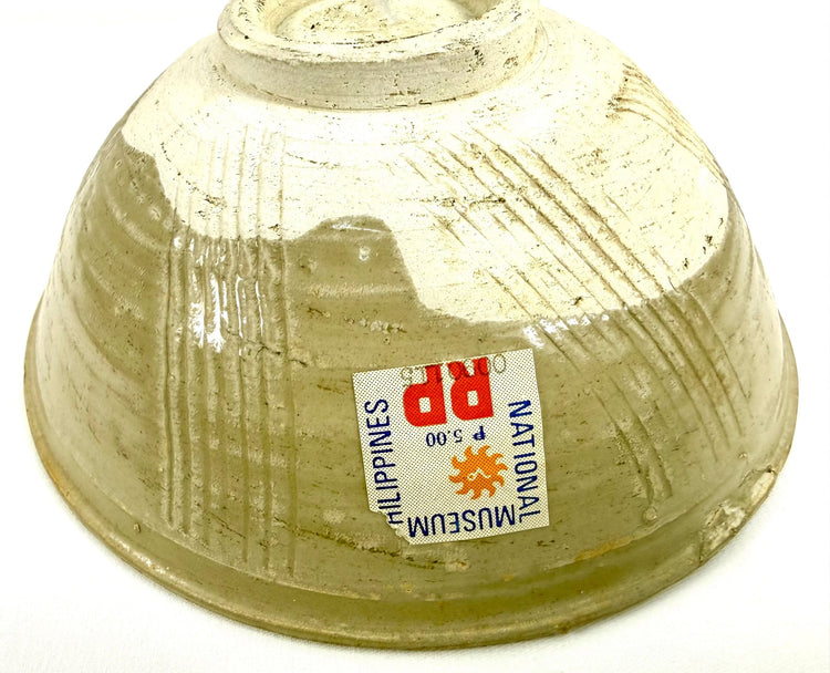 Chinese Song Dynasty shipwreck pottery bowl displaying marine mineral deposits, aged celadon glaze, and distinctive hand-finished ceramic construction.