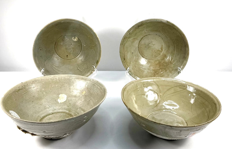 Set of four ancient Chinese Song Dynasty celadon bowls dating to the 12th century CE, recovered from the Jepara Shipwreck off the coast of Java, Indonesia.