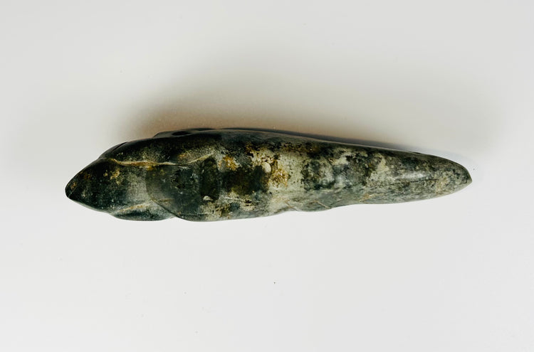Pre-Columbian jade-like animal carving with polished surface and suspension hole