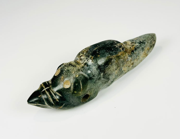 Ancient Mesoamerican jade-like carved animal pendant with polished surface