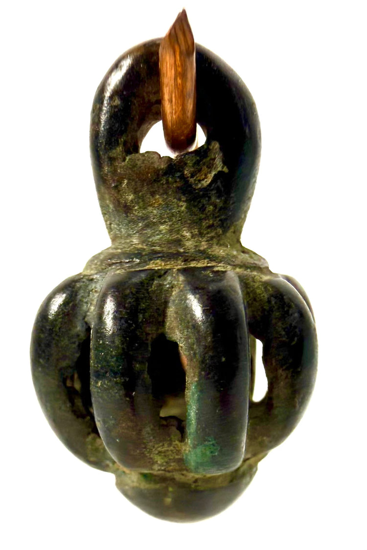 Ancient Luristan bronze rattle bell from Western Iran, dating to the 10th–7th century BCE, featuring a globular openwork body and integral suspension loop.