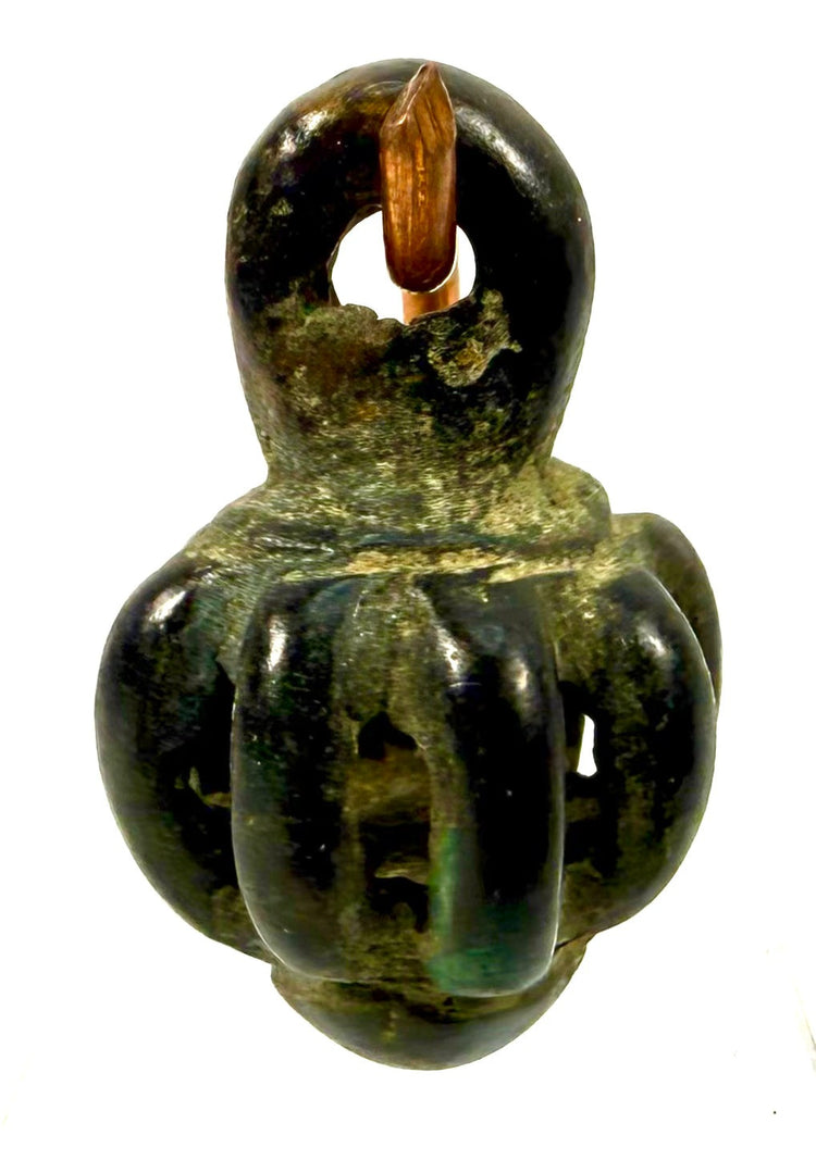 Iron Age Persian bronze pendant bell with vertical openwork bars, rounded hollow construction, and dark green archaeological patina.