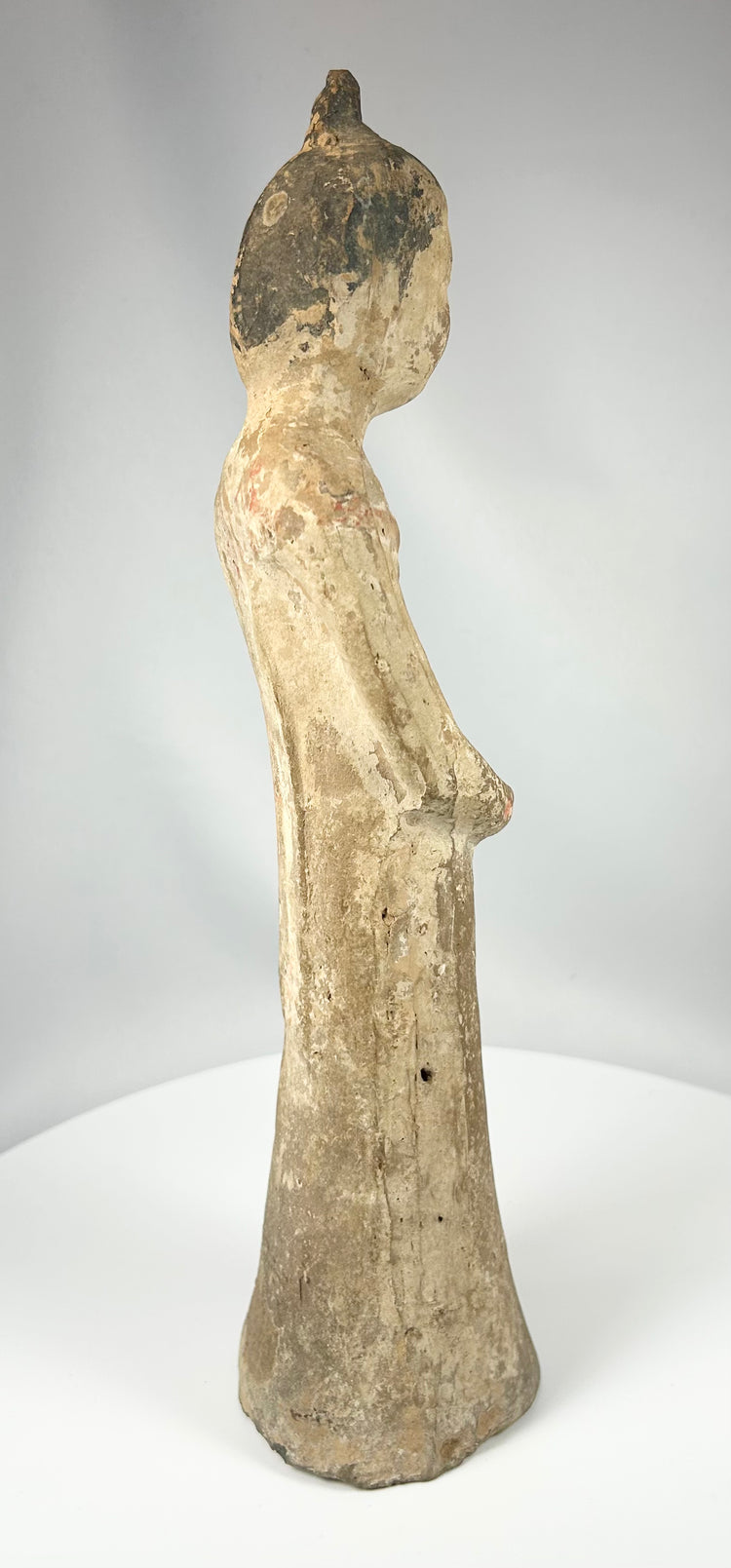 Chinese earthenware figurine of court attendant with high coiffure hairstyle