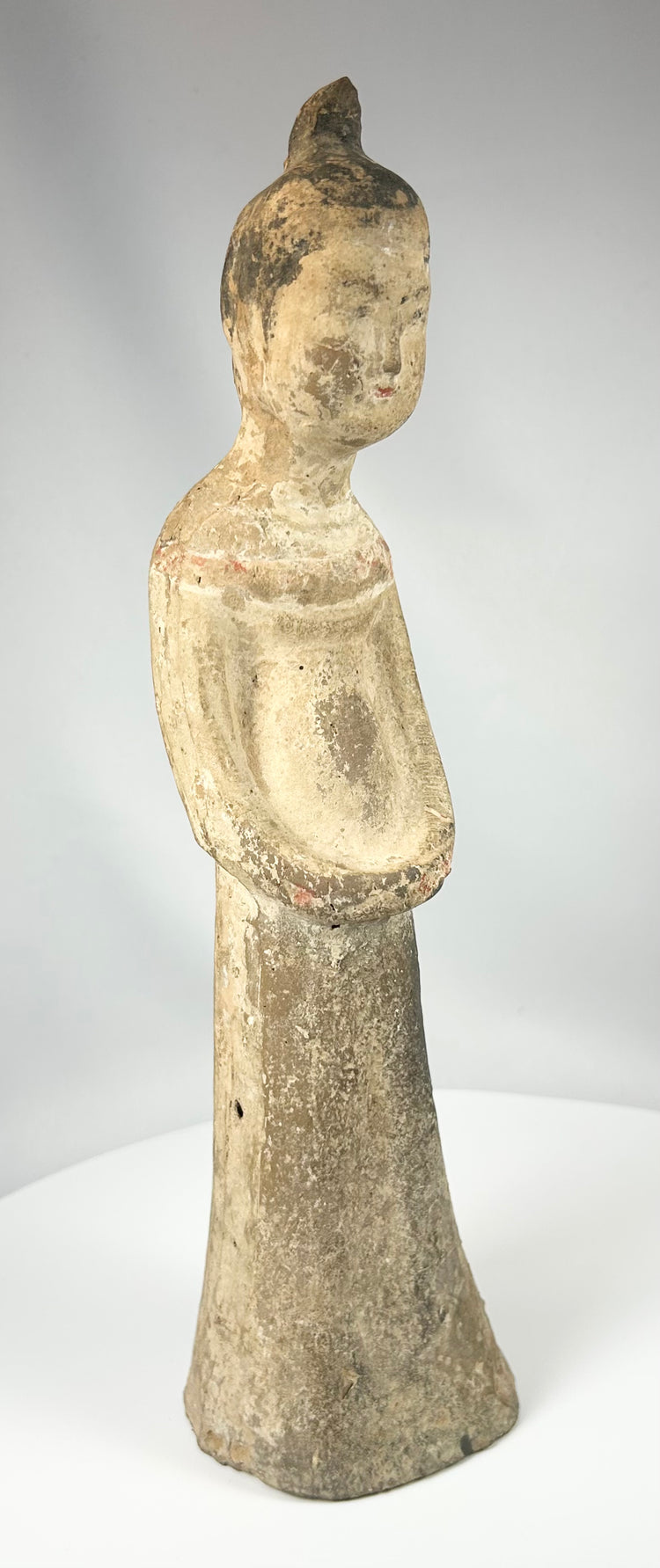 Tang style ceramic attendant figure with traces of pigment and natural wear