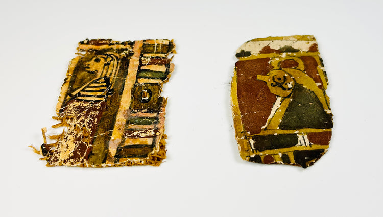 Egyptian funerary textile fragments with painted imagery and aged surface
