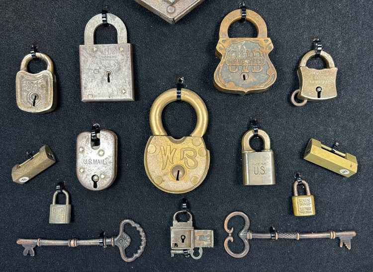 Antique padlocks and keys collection with varied shapes and historic markings