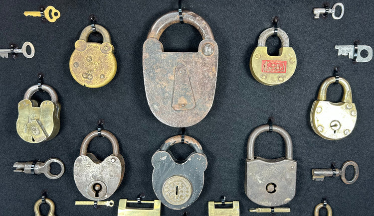 Antique locks and keys display with varied padlock styles and patina