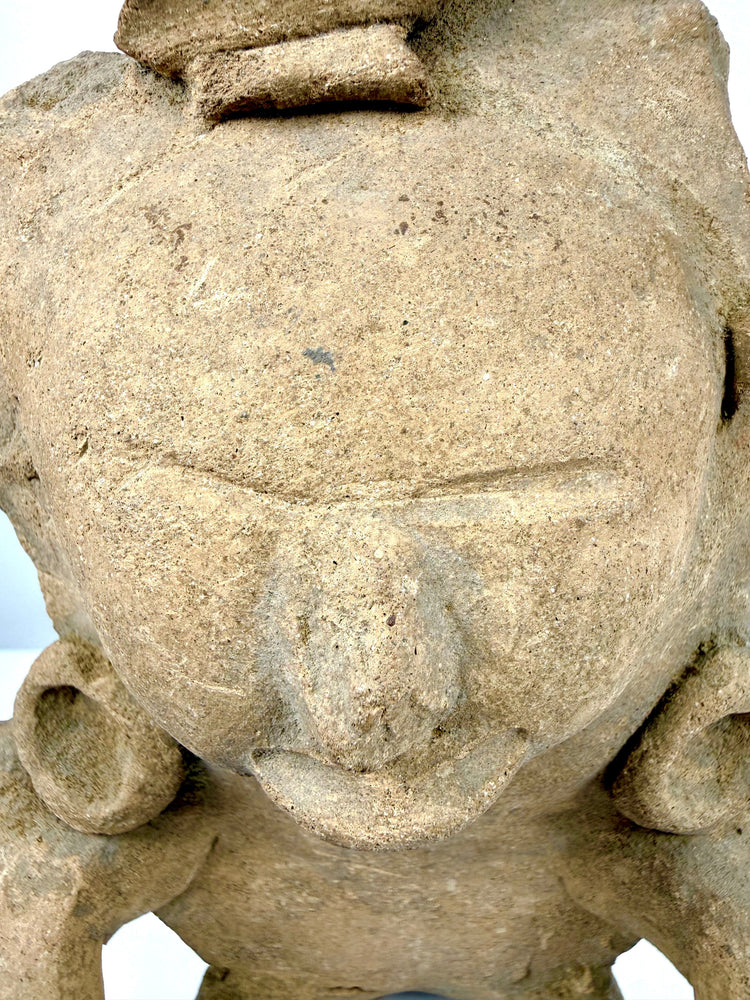 Traditional Mesoamerican terracotta sculpture featuring granular clay textures, age-related surface wear, and preserved ornamental details.