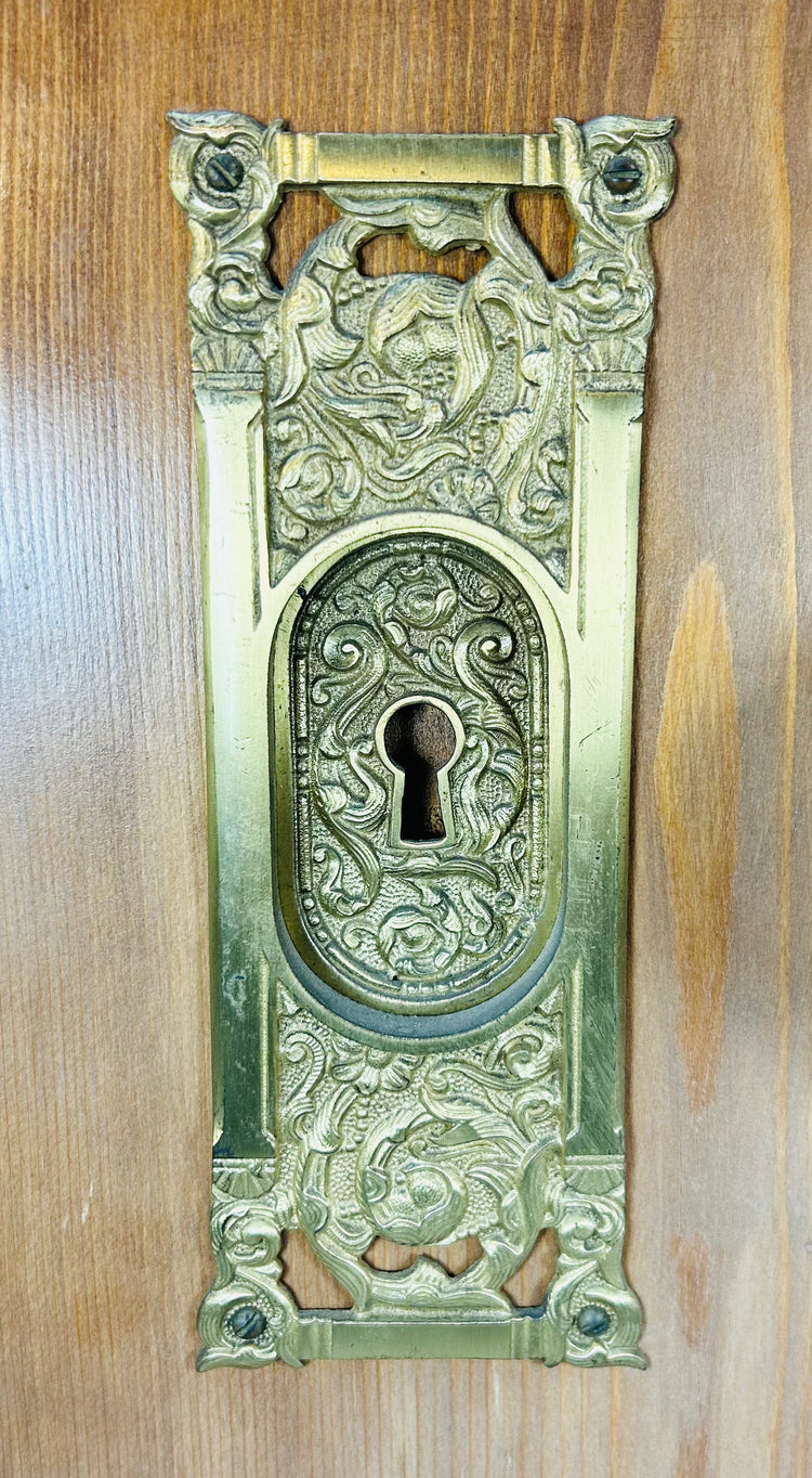 Antique door hardware board with cast brass components and original key