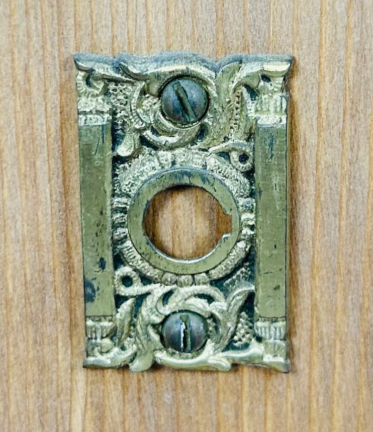 Antique Reading lockset with brass knob, hinge, and strike plate on wood base