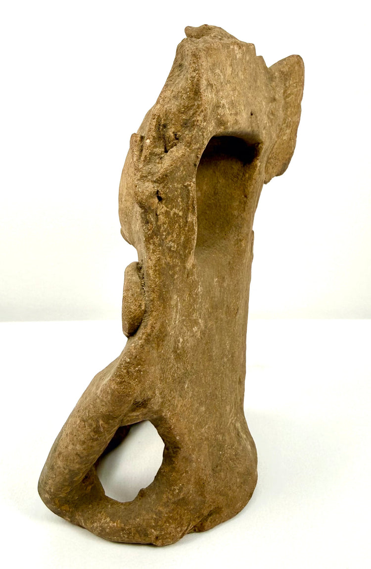 Classic Period Mesoamerican pottery figurine featuring an ornate raised headdress with projecting side elements and detailed sculptural modeling.