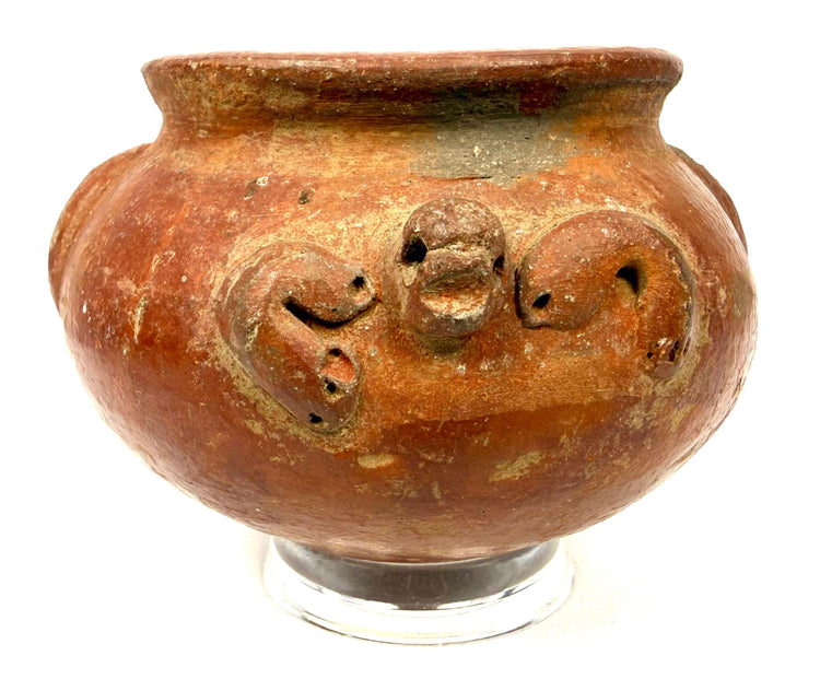 Pre-Columbian terracotta pottery vessel from Central or South America, circa 1000–1500 CE, featuring a rounded body and sculpted relief decoration.