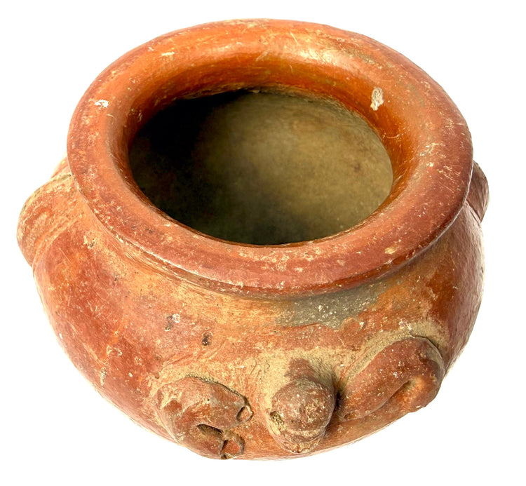 Ancient Central or South American ceramic vessel with a reddish-brown surface, sculptural embellishments, and traditional handcrafted construction.