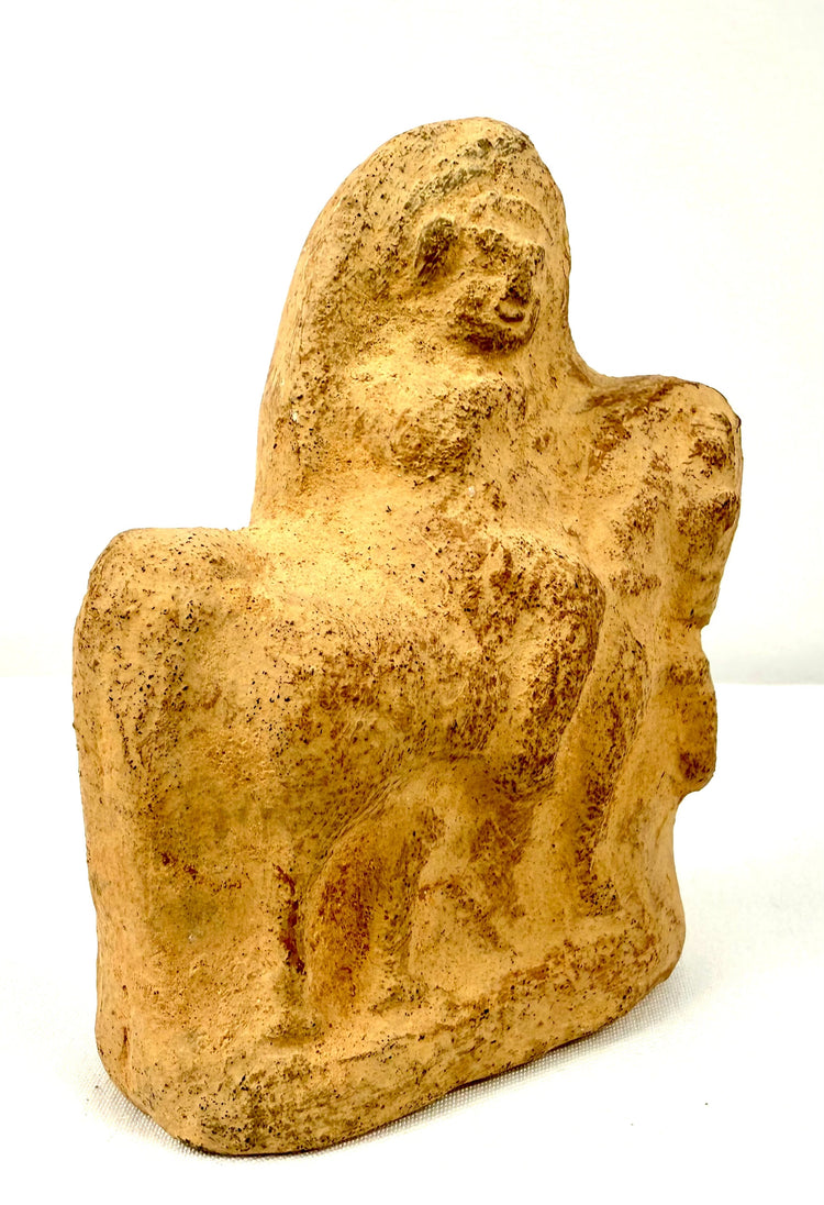Ancient terracotta horse and rider sculpture featuring a small perforation on the reverse, softened modeling, and visible surface wear.