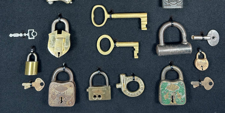 Antique locks and keys exhibit featuring 19th to early 20th century security hardware with natural patina
