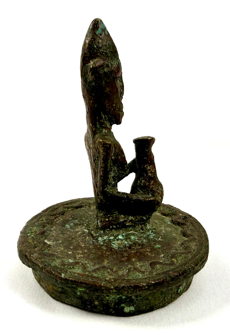 African bronze container attributed to Mali, displaying sculptural supports, surface oxidation, and preserved geometric ornamentation.