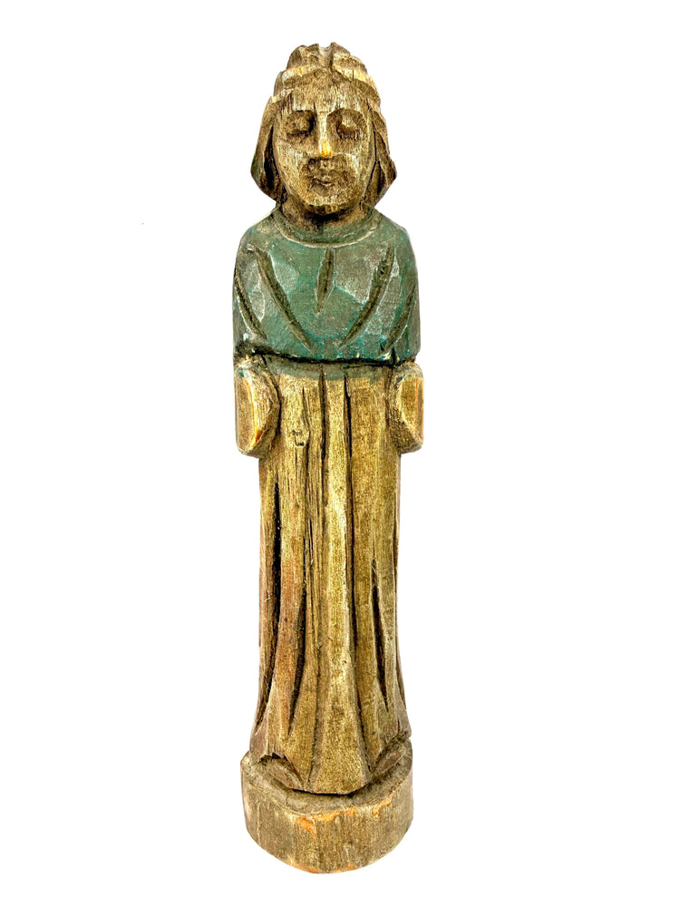 Frontal view of circa 18th-19th century European wooden figurine with hood and green tunic