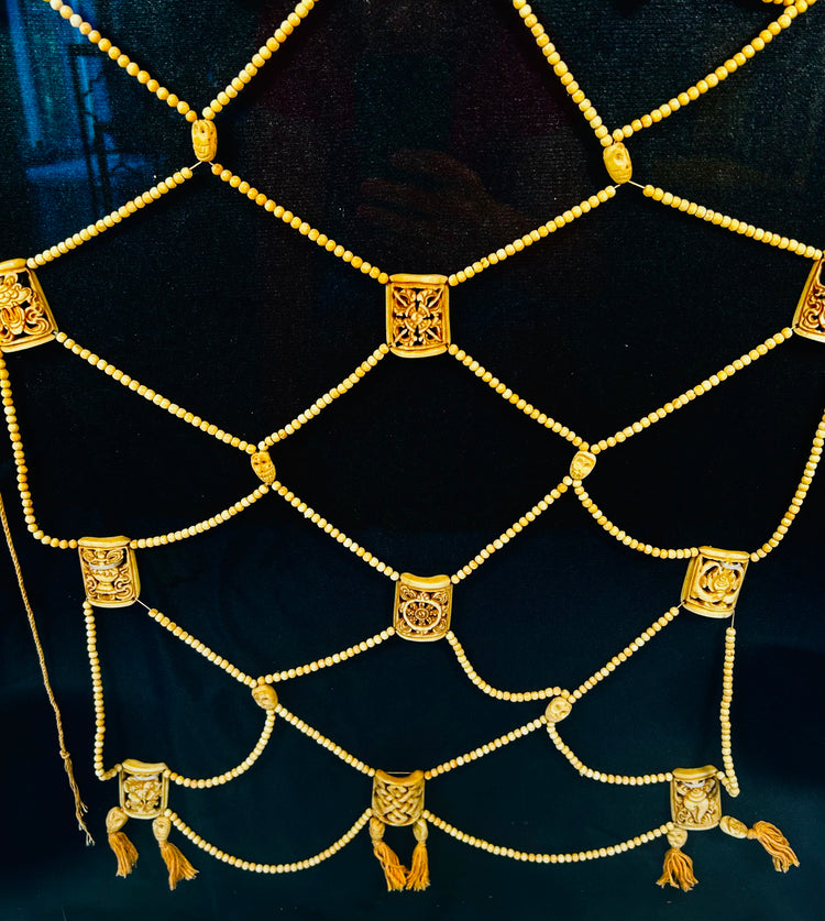 Tibetan tantric apron with bone bead lattice and painted deities