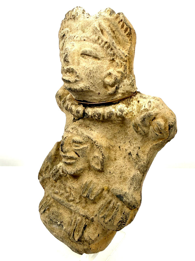 Veracruz ancient pottery profile showing rough clay texture and dark weathering spots