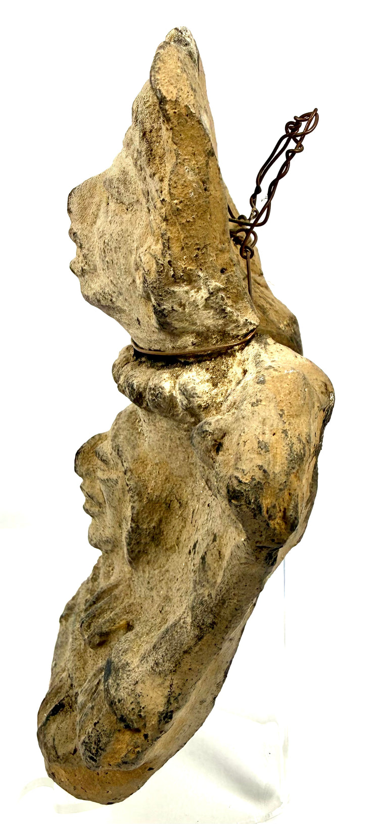 Side view of flat-backed Pre-Columbian ceramic with hanging wire loop attachment