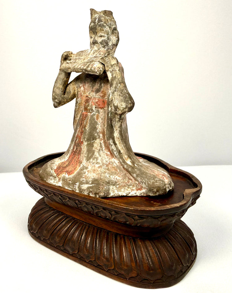 Tang Dynasty terracotta court musician statue with pan flute and pigment traces