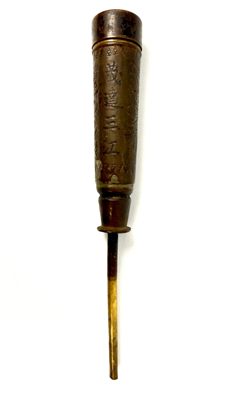 Full length antique Chinese bronze candle holder with engraved characters and brass stem