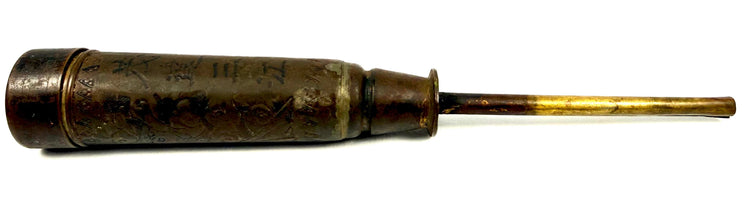 Side profile of Late Qing Dynasty brass candle holder with long golden metal spike
