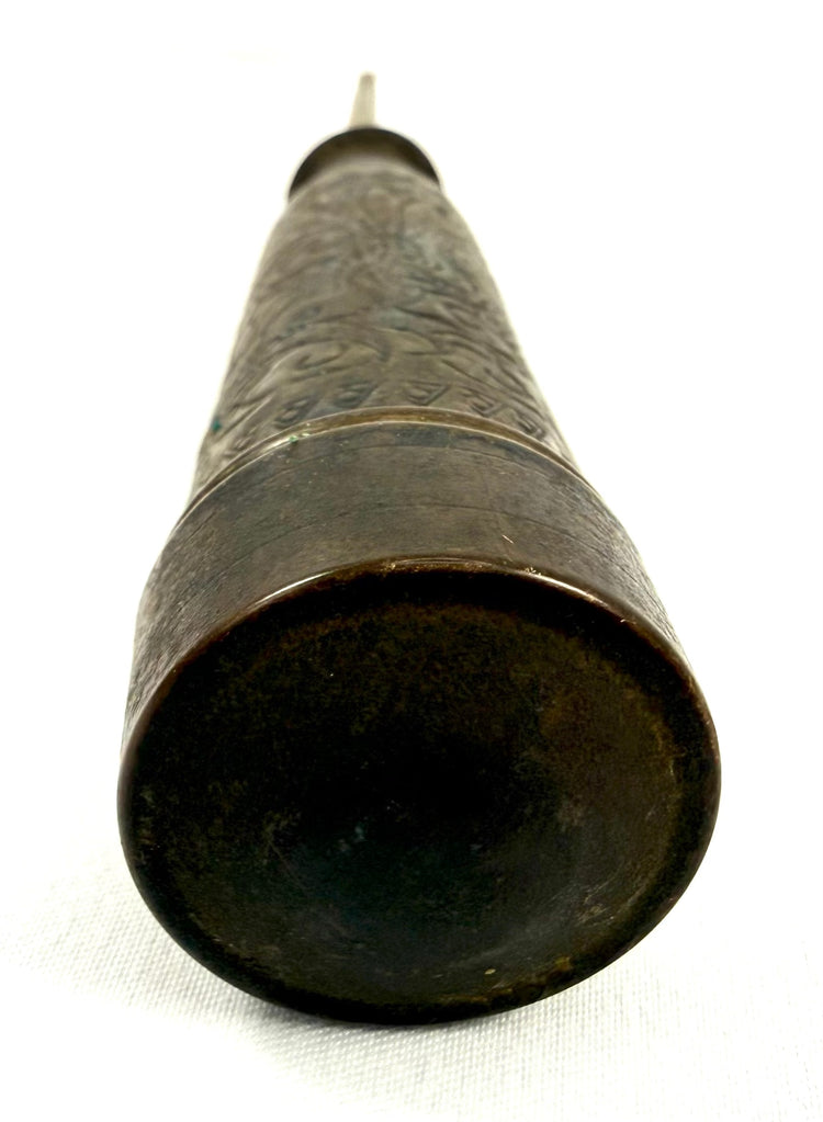 Interior view of antique bronze candle holder showing metal spike for holding candles