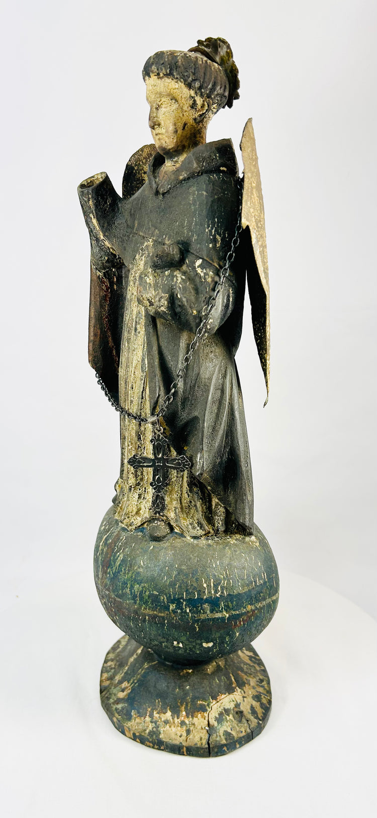 18th–19th century Colonial Latin American angel, standing on orb, remnants of painted surface
