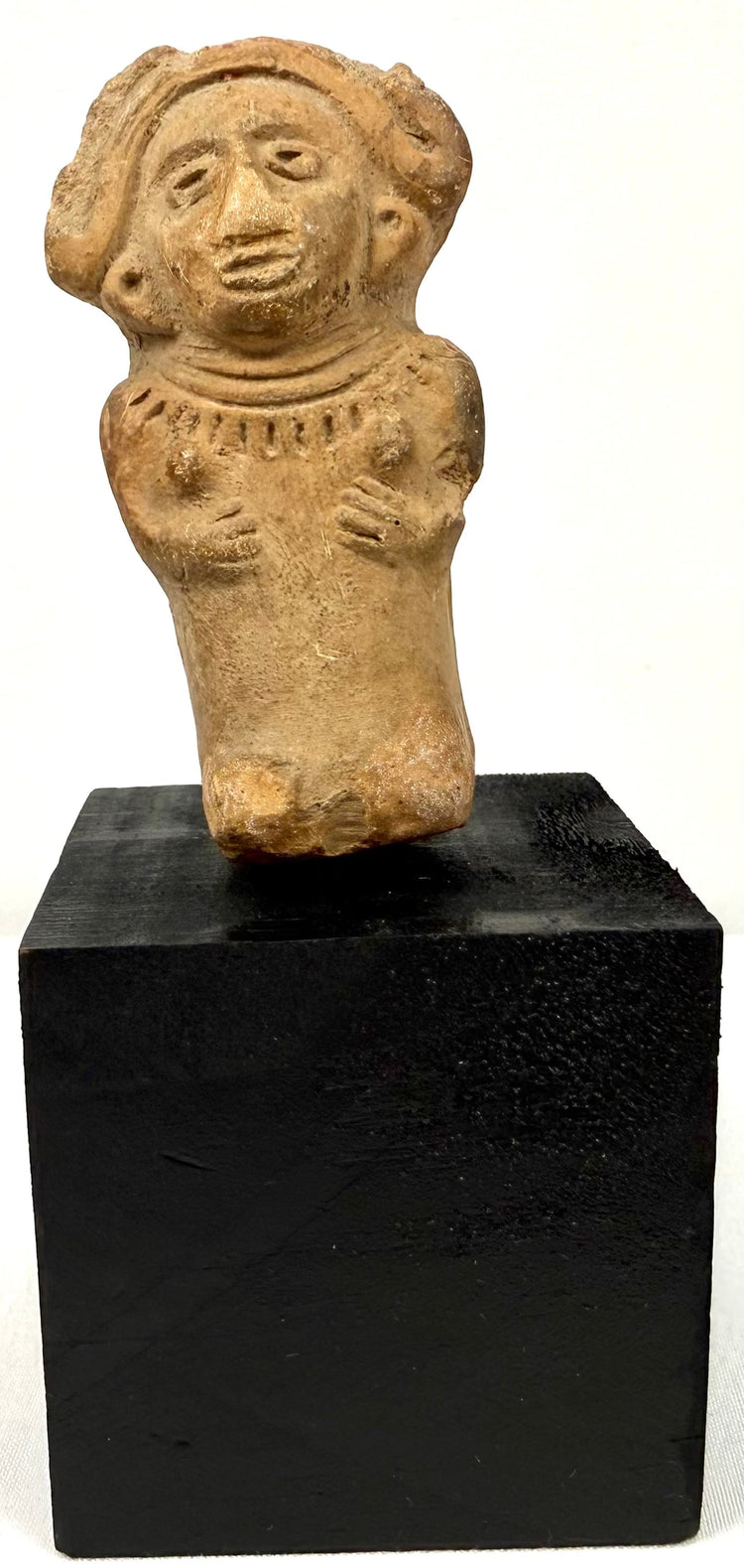 Veracruz terracotta seated female figurine with headdress, circa 600–900 CE
