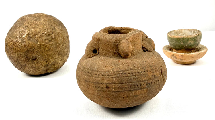 Set of three ancient relics: stone sphere, ridged pot, and glazed dish