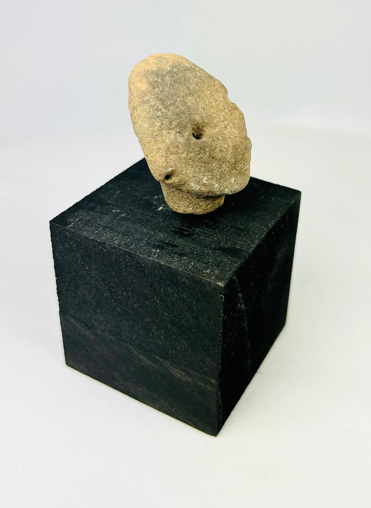 Pre-Columbian terracotta head fragment, West Mexico, drilled eyes, rounded features, Nayarit or Jalisco, 300 BCE–300 CE