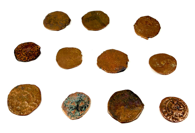 Ancient copper-alloy Levant coins showing dark oxidation