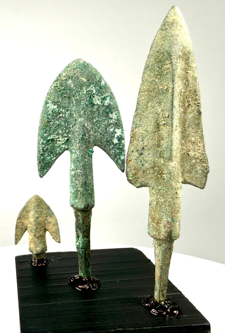Alternate angle of mounted bronze projectile points showing corrosion