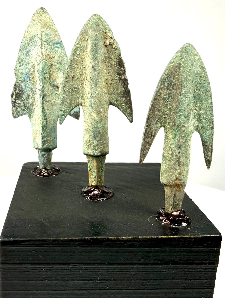 High-angle shot of corroded bronze tips emphasizing metal texture