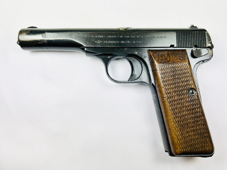World War II Belgian Browning FN Model 1922 pistol with walnut grips and engraved markings