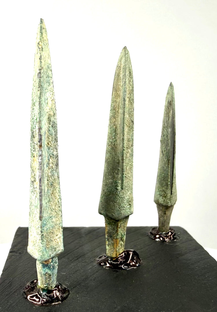 Rear view of elongated bronze points featuring central ridges