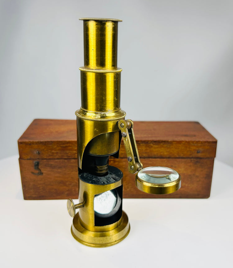 Victorian scientific instrument microscope with brass construction and optical glass