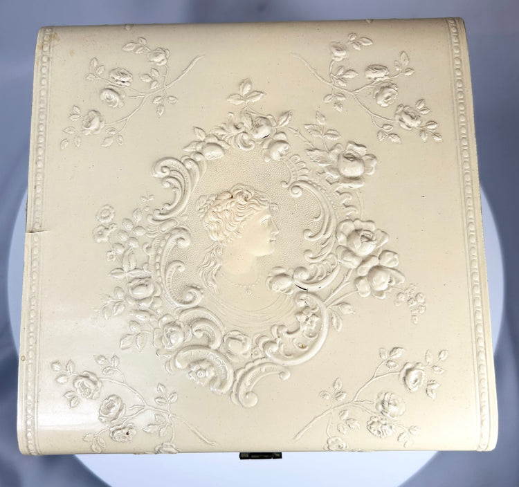 Antique molded case with floral relief and original detachable collars