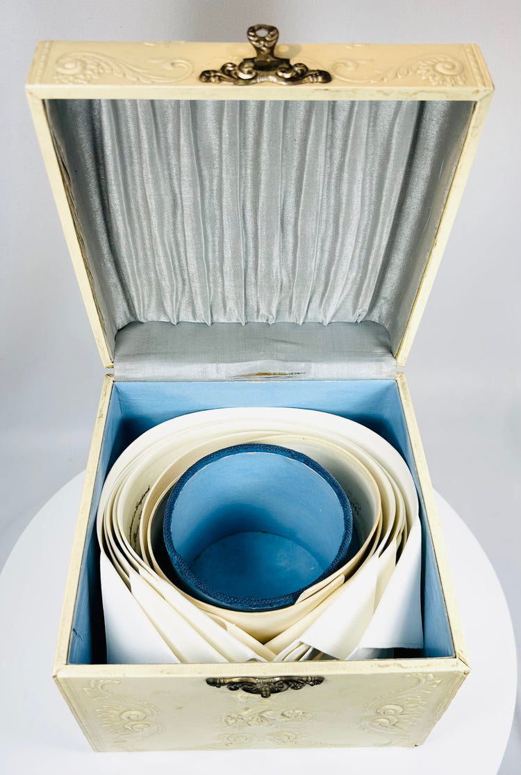 Antique detachable collar box with silk interior and decorative relief exterior