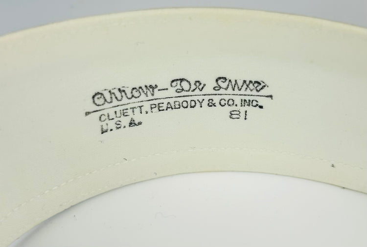 Edwardian collar box with ornate exterior and preserved linen collars