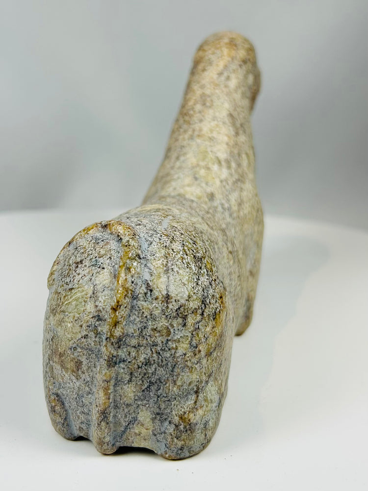 West African tribal artifact with stylized animal shape and aged surface