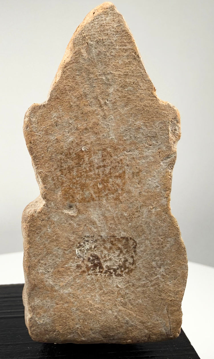 Historic South Asian terracotta sculpture depicting a possible spiritual figure with a distinctive headdress and schematic body details.