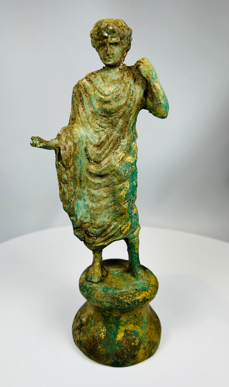Classical Revival bronze statue with flowing robes and aged patina